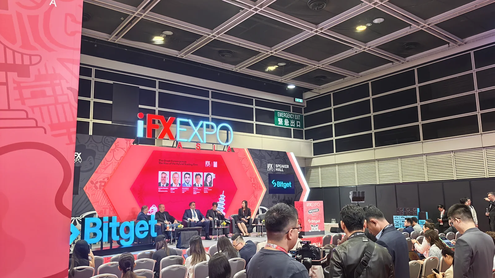 The main stage and audience at iFX EXPO Asia 2026 in Hong Kong during a discussion of the hybrid trading firm