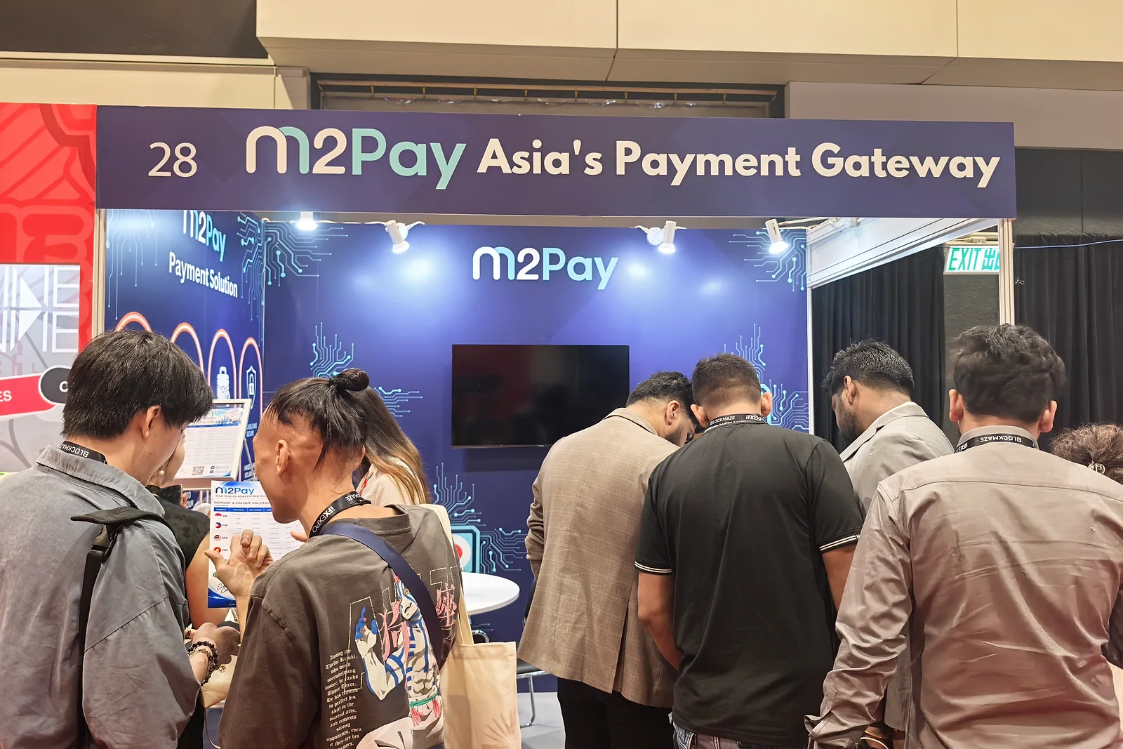 Delegates gather at a payment-gateway stand
